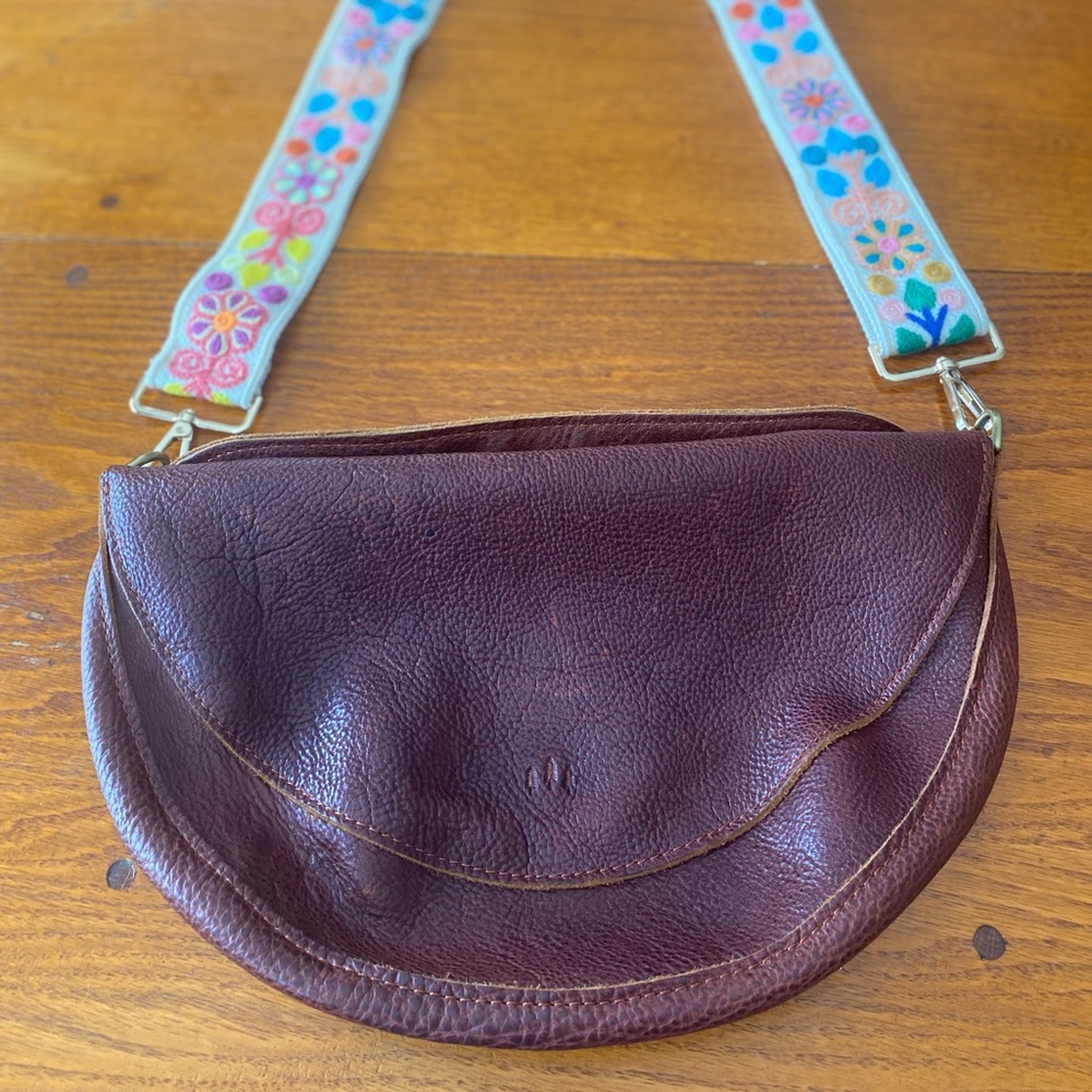 Portland Leather Nutmeg Koala Sling bag with fabric strap.